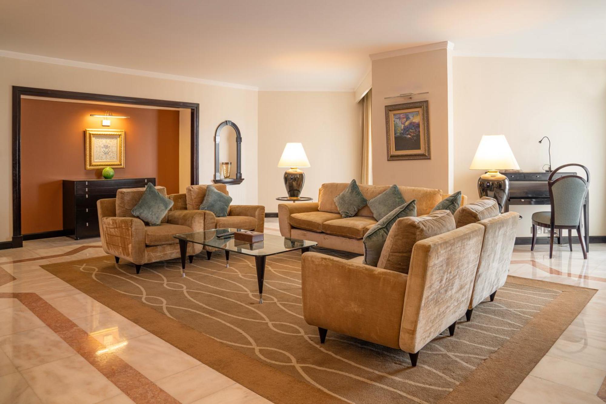 Danat Al Ain Resort Kültér fotó A living room in a suite at the Jumeirah Emirates Towers Hotel